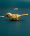 Side view of Brass Bird Knob Door Handle for Cabinets and Drawers, 62mm long, Solid Brass Kitchen Cupboard Pull on blue background