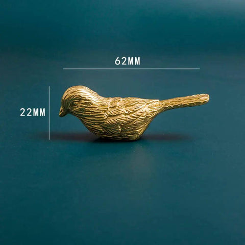 Side view of Brass Bird Knob Door Handle for Cabinets and Drawers, 62mm long, Solid Brass Kitchen Cupboard Pull on blue background