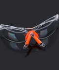 Four Pack Real Deal Fogless Safety Glasses With Thick Padding And Rounded Edges Windproof Splash Goggles Built Tough For Construction Carpentry And Garage Work Heavy Duty Kick Safe Eye Gear That Stays Totally Crystal Clear All Day, transparent goggles with orange padding.