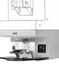 Automatic Espresso Tamper Dialing In Perfect Pressure And Custom Tamping Profiles To Nail That Puck Prep Hassle Free Barista Workflow Smooth White Housing, close-up view, display and tamper feature.