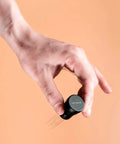 Hand holding WDT Distribution Tool V2 Nine Prong Espresso Tool with 0.3mm wire needles and anodized aluminum handle