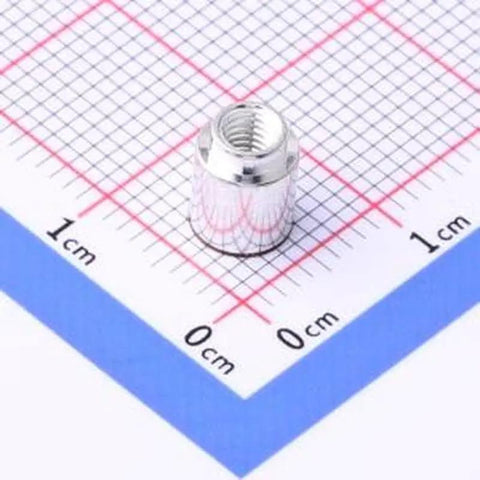 Twenty Heavy Duty SMD Surface Mount Standoff Columns M3X5.4 Copper Tinned Round Nuts for Electronics hardware on graph paper.