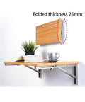 Premium 304 Stainless Steel Folding Shelf Brackets Triangle Wall Mounts showcasing a 25mm thick wooden shelf with books and a mug.