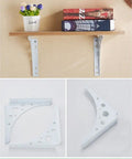 Built Like A Tank Wrought Iron Corner Shelf Bracket Wall Mount Rack Heavy Duty Triangular Support Decorative White Finish, installed with wood shelf and books.