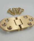 Brass-colored folding table hinge with screws, showcasing open-close mechanism and hole alignment for aircraft-style tables