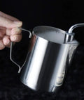 Solid No Fuss Compact Fully Automatic Bean To Cup Coffee Maker Black One Touch Grinding Machine showing a stainless steel milk frothing pitcher.