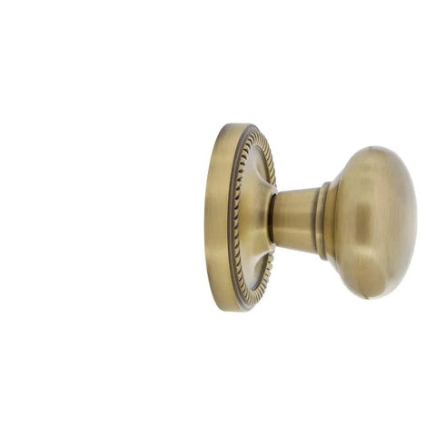 Side view of Rope Rosette Door Knob Set With New York Knob In Antique Brass, Passage Function, Vintage Style for 1 3/8 to 1 3/4 inch doors.