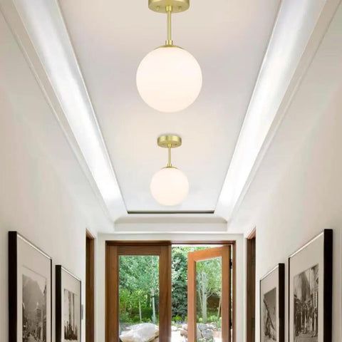Semi Flush Mount Ceiling Light With Globe White Shade In Satin Brass Finish 1 Light Modern Fixture For Living Room And Dining Room With Chic Contemporary Vibe Close To Ceiling Design installed in hallway