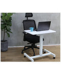 Super Versatile Height Adjustable Laptop Desk For Bed Or Couch Foldable Portable Side Table With Smooth Rolling Wheels next to a black office chair