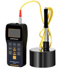 Portable Leeb Hardness Tester Kit With Copper Test Block 7 In 1 HL HV HB HRC HRB HRA HS For Quick Accurate Metal Hardness Testing On The Go With Easy Menu OLED Display, showing handheld device and impact device on metal block.
