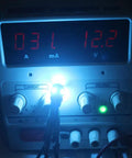 Testing Lit Ice Blue 12V 194 W5W LED Bulb Replacement Kit, 12 Pack, 0.8W Each, 80 Lumens, 5 SMD 5050, on power supply
