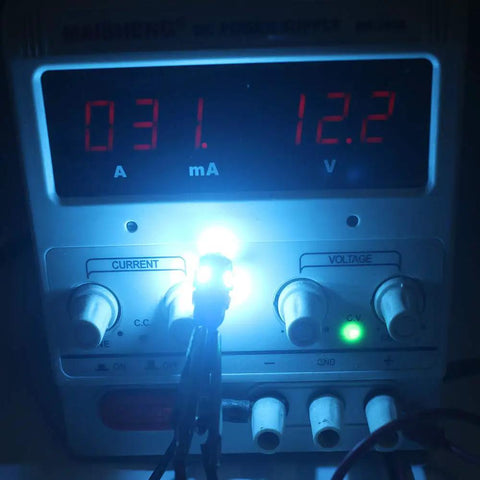 Testing Lit Ice Blue 12V 194 W5W LED Bulb Replacement Kit, 12 Pack, 0.8W Each, 80 Lumens, 5 SMD 5050, on power supply