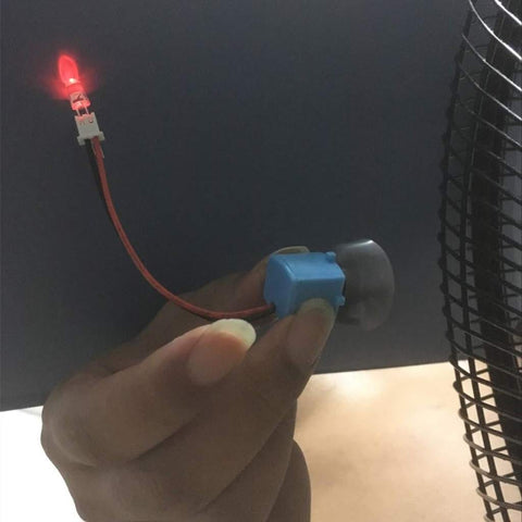 Hand holding a small Wind Hydroelectric Generator Model For STEM Classrooms, Hands On Renewable Energy Teaching Kit With Quick Assembly Parts