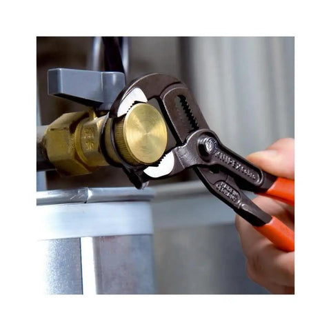 Cobra Water Pump Pliers 10 Inch with self-locking grip adjusting brass nut, showcasing precision and heavy-duty use.