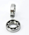 Close-up of open 7x14x3 Point 5mm 687 mini ball bearings for RC cars, showing inner rings and balls, pro grade upgrade parts.