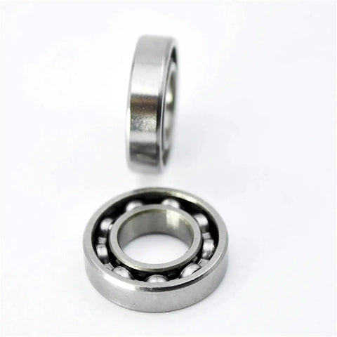 Close-up of open 7x14x3 Point 5mm 687 mini ball bearings for RC cars, showing inner rings and balls, pro grade upgrade parts.
