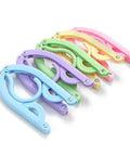 Colorful 10 Pack Travel Hangers for Cruises and Trips, Portable Folding Clothes Hangers, folded colorful hangers in a row