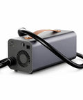 Plug And Play Tesla V2L Power Adapter with black cable and alloy enclosure, ideal for outdoor camp setups and powering gear.