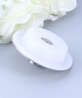 Bathtub Drain Stopper Plug for 40-45mm Holes Stainless Steel, circular white plug on gray surface with decorative flowers.