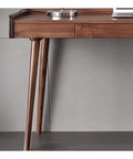 Ergonomic Adjustable Standing Desk Featuring Rich Walnut Desktop Four Deep Storage Drawers Integrated Monitor Stand close-up of desk leg and drawer