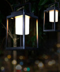 Rechargeable Outdoor Table Lantern With USB Port No Wires Needed, 350 Lumen Cordless Lamp, hanging in a garden at night