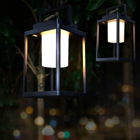 Rechargeable Outdoor Table Lantern With USB Port No Wires Needed, 350 Lumen Cordless Lamp, hanging in a garden at night