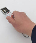 Hand holding Single Flint Torch Lighter Kit For Welding And Cutting Pack Of 2 With 20 Spare Flint Replacements Easy Ignite Spark