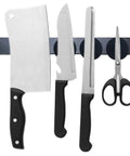 Six epoxy-coated neodymium disc magnets on a magnetic strip holding kitchen knives and scissors