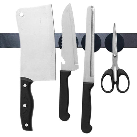 Six epoxy-coated neodymium disc magnets on a magnetic strip holding kitchen knives and scissors