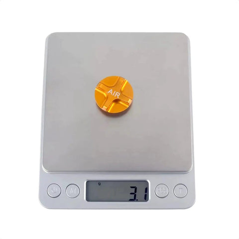 Gold Aluminum Front Fork Cap Suspension Cover For Mountain And Road Bikes on digital scale weighing 3.1 grams