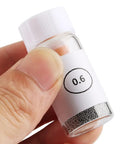 Close-up of a 0.6mm bottle from the Pro Grade BGA Reball Solder Balls Kit 0.6mm For GPU CPU IC Chips And PCB Soldering Universal Stencil Ball Set
