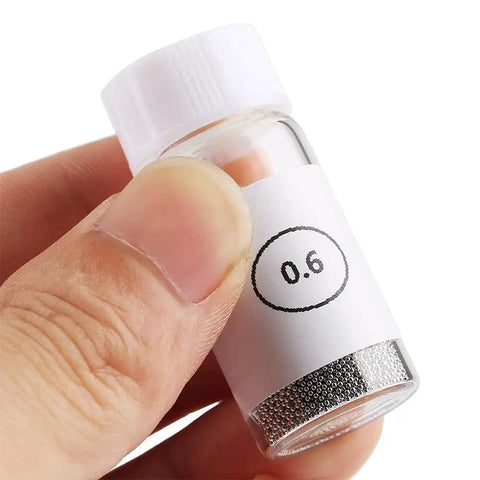 Close-up of a 0.6mm bottle from the Pro Grade BGA Reball Solder Balls Kit 0.6mm For GPU CPU IC Chips And PCB Soldering Universal Stencil Ball Set