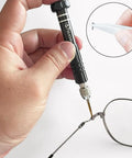 Hand using Must Have Eyeglass Repair Kit With S2 Steel Precision Screwdriver And 15 Screw Sizes for quick at home fixes on glasses hinge