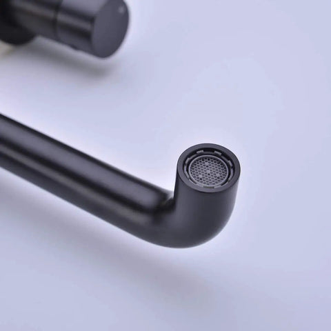Close-up of Brass Matte Black Dual Handle Wall Mounted Bathroom Faucet With Rough In Valve No Frills Install, aerator detail.