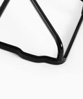Close-up of shiny black metal corner of Beefed Up Heavy Duty Replacement Burner Grates Set For GE Kenmore Hotpoint Stove Parts