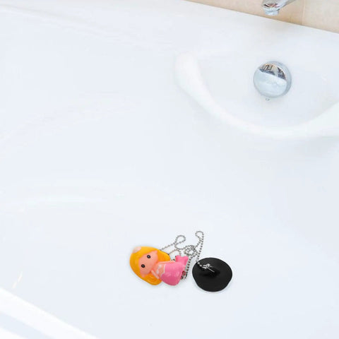 Mermaid Bathtub Stopper Plug Rubber Drain Seal with Chain in a white bathtub, featuring a colorful mermaid design and drain plug.