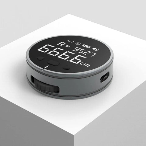 Rechargeable Digital Tape Measure For Long Distance Measuring, round shape, LCD display, showing measurement in cm.