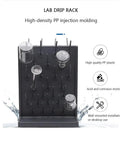 ZcbYbt 2-Piece Black PP Wall-Mounted Drying Rack Lab Supplies 54 Pegs displaying lab glassware with droplets for drying.