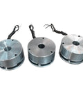 Three aluminum DC motor electromagnetic brake modules with attached wiring.