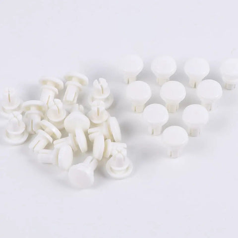 100 Piece Tough As Nails R Type Plastic Rivet Nut Kit With Nylon Buckle Clips For Car Panels And Pcb Boards Snaps Right In For Auto Trim And Diy Fixes No Sweat Installation Guaranteed All Day. White nylon rivet nuts arranged on a white surface.