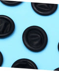 1000 Pack Antistatic Finger Cots Providing A No Sweat Grip That Shields Precise Electronics During Heavy Mechanic Work And Warehouse Tasks While Delivering Knockout Quality On A Tight Budget, black latex finger cots on a blue background.