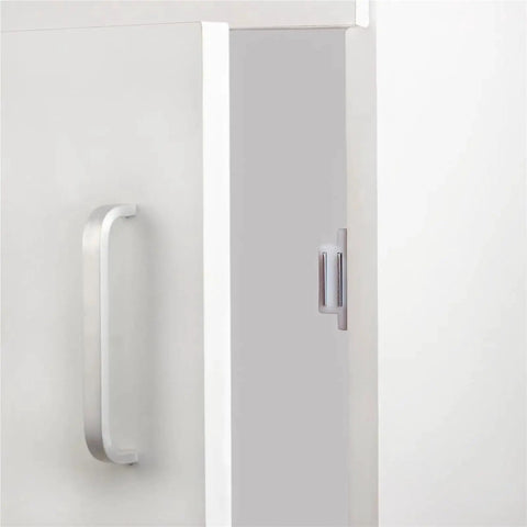 Push To Open Cabinet Latch Set Stainless Steel Magnetic Catch installed on white kitchen cabinet door