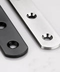 Close-up of Stainless Steel Flat Mending Plates Set Of 4 For Wood And Metal Repair, 12 Inch Length, Black and silver finish with holes.