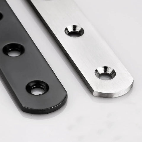 Close-up of Stainless Steel Flat Mending Plates Set Of 4 For Wood And Metal Repair, 12 Inch Length, Black and silver finish with holes.