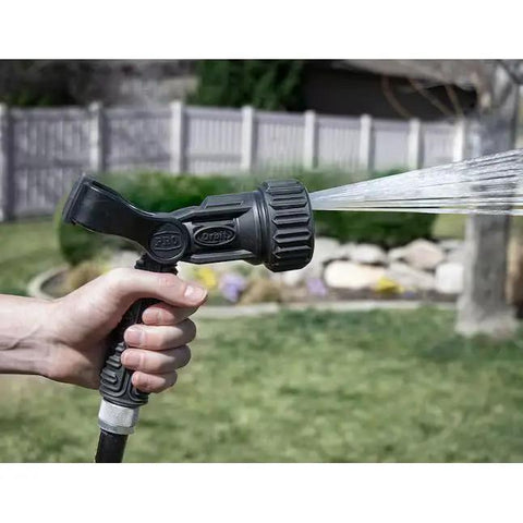 Heavy Duty Seven Pattern Firemans Hose Nozzle With Adjustable Pressure Rust Proof Yard Sprayer Tough As Nails For Garden Cleanup image featuring spray in use