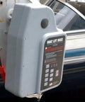 Gen 6 Direct Drive Boat Lift System With Install Kit And Handy Smartphone App Control For Easy Auto Stop Auto Run Programmable Limits And Field Serviceable Components, gray dock-mounted unit on boat lift