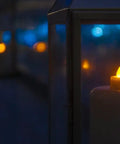 Wireless Inductively Rechargeable Flameless LED Tealight Candles Replacements 12 Pack Warm White glowing in lanterns at night