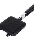 Durable Aluminum Grilled Sandwich Maker For Stovetop Use. Non-Stick Toastie Press Grill with black handle and textured cooking surface.