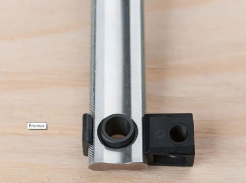 Close-up of a steel clamp rail and KP block from Hardcore Heavy Duty K Body Clamp Kit With Two 24 Inch And Two 50 Inch Bars Plus Kp Blocks.