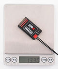 ExpressLRS 2.4GHz 6 Channel PWM Receiver for FPV Drones, Airplanes and Gliders on digital scale showing weight.